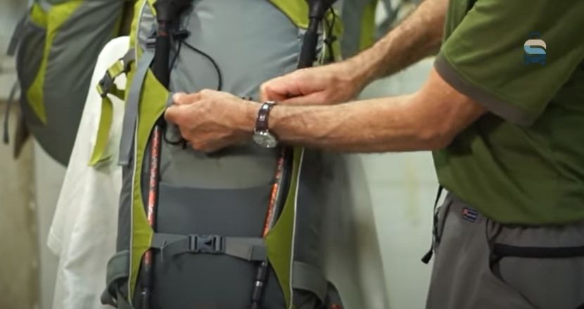 how to attach trekking poles to backpack